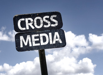 Cross Media sign with clouds and sky background