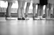 Little ballerinas legs standing in a row; monochrome
