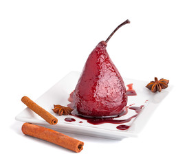 poached pears in wine syrop with cinnamon isolated
