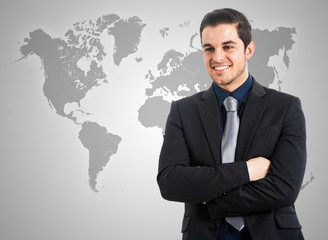 Poster - Businessman in front of a world map