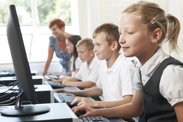 Wall Mural - Group Of Elementary Pupils In Computer Class With Teacher