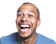 Leinwandbild Motiv Portrait of a mixed race man laughing hysterically