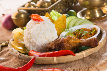 Wall Mural - Famous traditional Indonesian food. Delicious nasi ayam penyet w