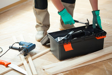 Wall Mural - Man with toolbox during renovation