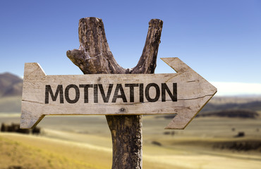 Motivation wooden sign with a desert background
