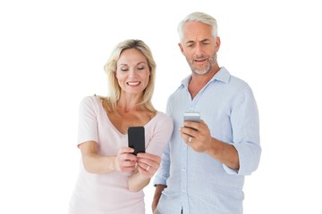 Poster - Happy couple texting on their smartphones