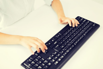 Wall Mural - student girls hands typing on keyboard