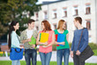 © Syda Productions - group of smiling students standing