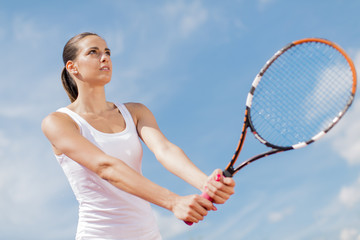 Young woman playing tennis