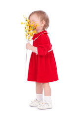 Happy little girl with yellow flower isolated over white backgro