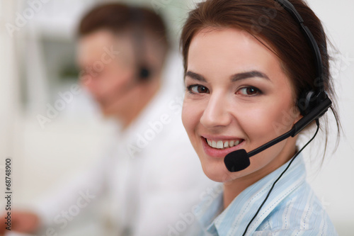 Fotografía Businesswoman with headset smiling at camera in call center