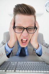 Poster - Angry businessman working on computer