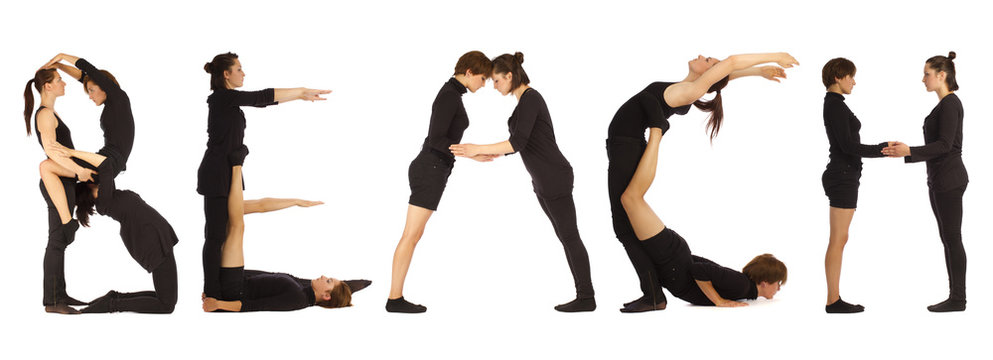 Black dressed people forming BEACH word over white