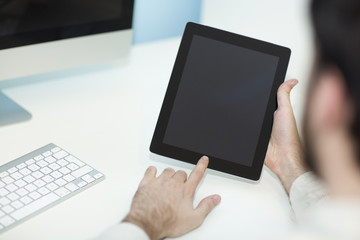 Man using tablet computer