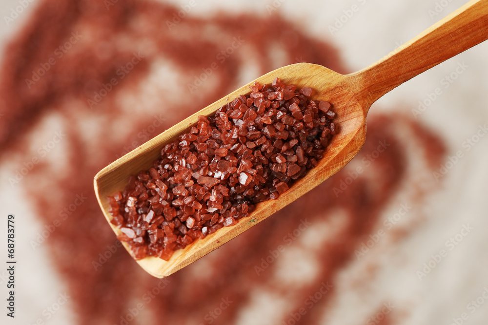 Sea salt in wooden spoon, close up