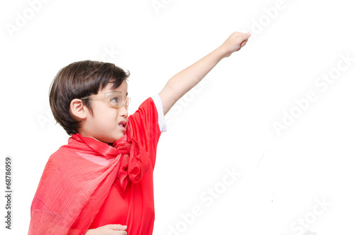 Fotografering A young boy is dressed up as a superhero flying