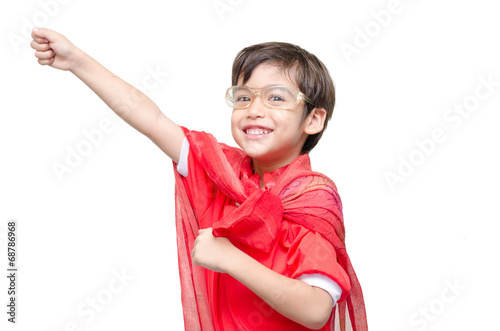 Fotografering little boy is dressed up as a superhero flying