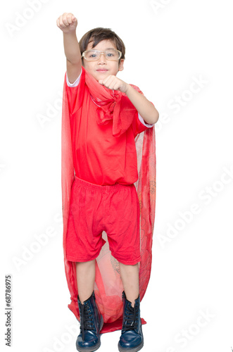Fotografering little boy is dressed up as a superhero flying
