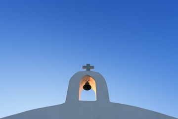 White Cross Against The Blue Sky