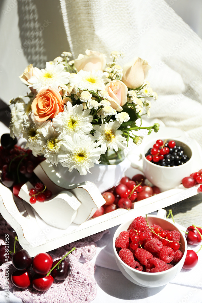 Still life with berries and flowers