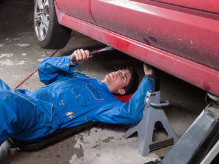 Mechanic repairing a a car