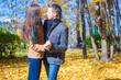 © travnikovstudio - Young couple in autumn park on a sunny fall day