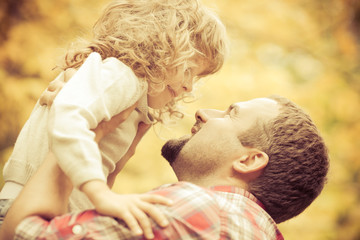 Happy father and child in autumn