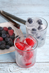 Poster - Frozen berries and ice cubes with mint leaves, raspberry and