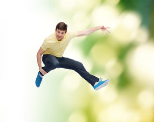 Sticker - smiling young man jumping in air