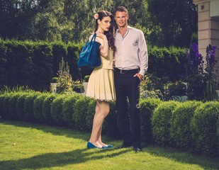 Young couple in luxury house garden