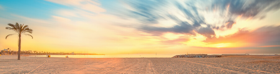 Wall Mural - barceloneta beach in barcelona at sunrise