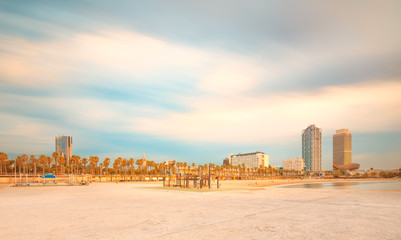 Wall Mural - barceloneta beach in barcelona at sunrise