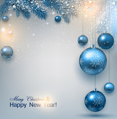 blue christmas background with fir twigs and balls. xmas baubles