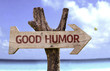 © gustavofrazao - Good Humor sign with a beach on background