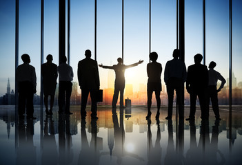 Wall Mural - Silhouettes of Business People in an Office Building
