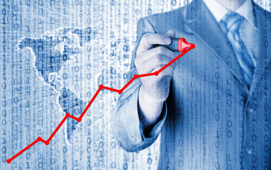 Business man drawing a growing graph