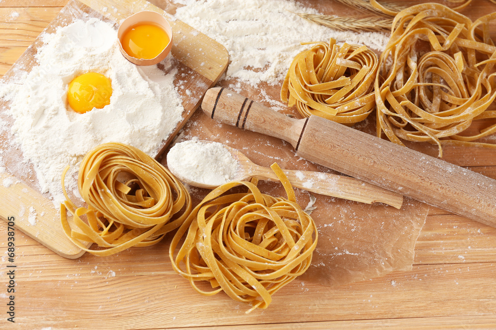 Still life with raw homemade pasta and ingredients for pasta