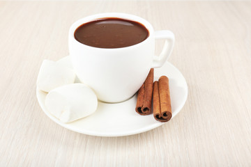 Wall Mural - Cup of hot chocolate on table, close up