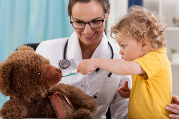 Wall Mural - Boy having fun at pediatrician's office