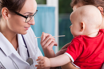 Wall Mural - Mother with baby during examination