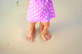 Fototapeta Morze - father and little daughter feet on a tropical beach