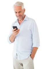Leinwandbilder - Smiling man sending a text message