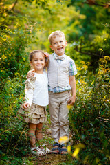 Boy with his sister in the park