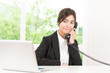 © siraphol - Business woman talking cellphone