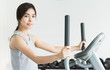© siraphol - Woman workout at fitness