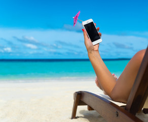 Woman hand showing mobile phone and cocktail umbrella