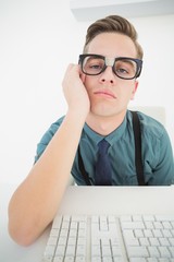 Poster - Casual bored businessman at his desk