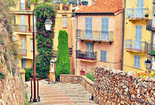 Street With Buildings And Paved Brick Walkway In Cannes, France