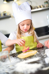 Wall Mural - happy children kid family preparing funny cake kitchen at home