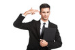 © BlueSkyImages - young businessman doing suicide symbol on white.